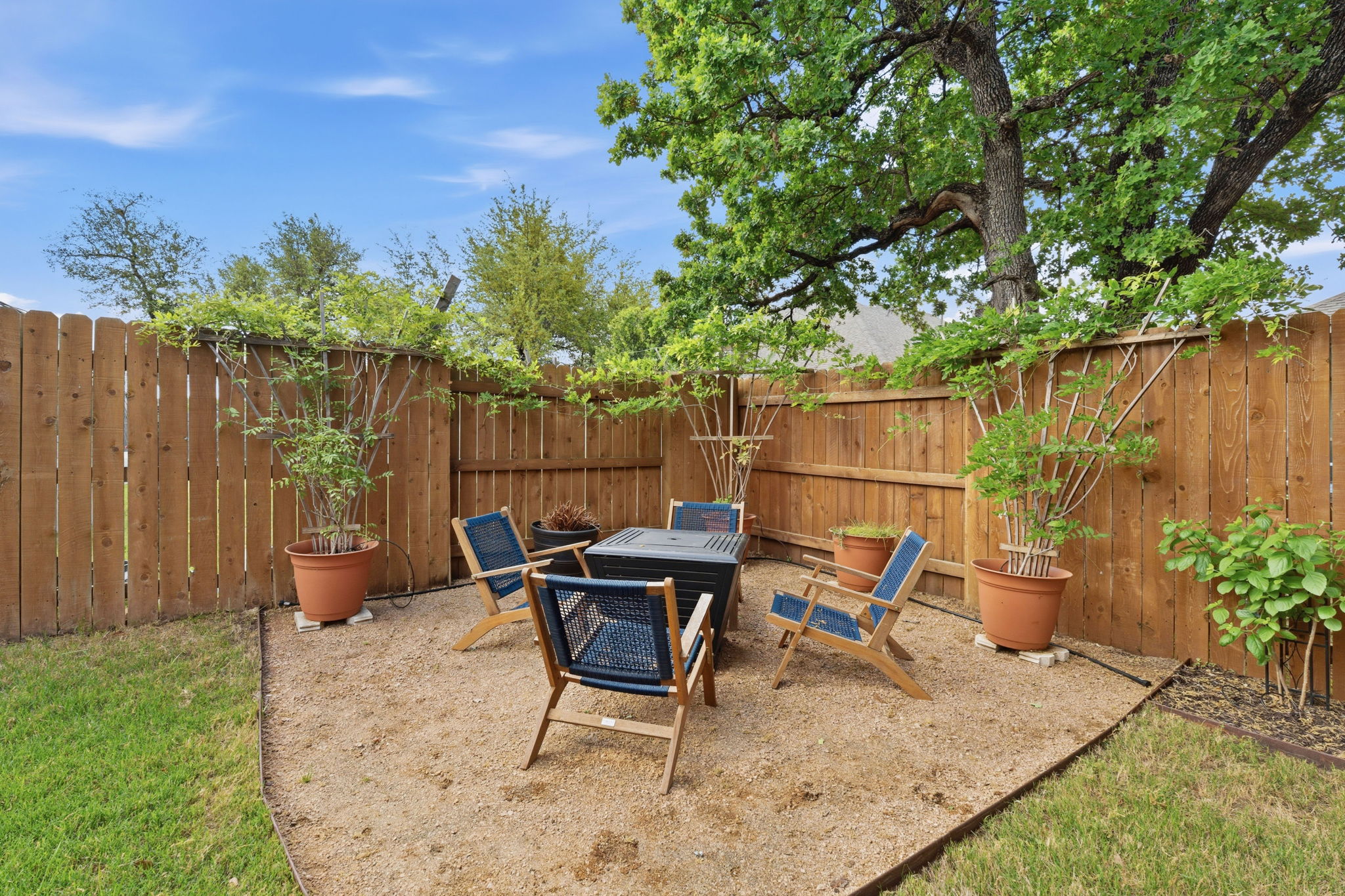 104 Red Granite Road Georgetown, TX 78633 - Photo 32 of 36 a view of a backyard with furniture and a garden
