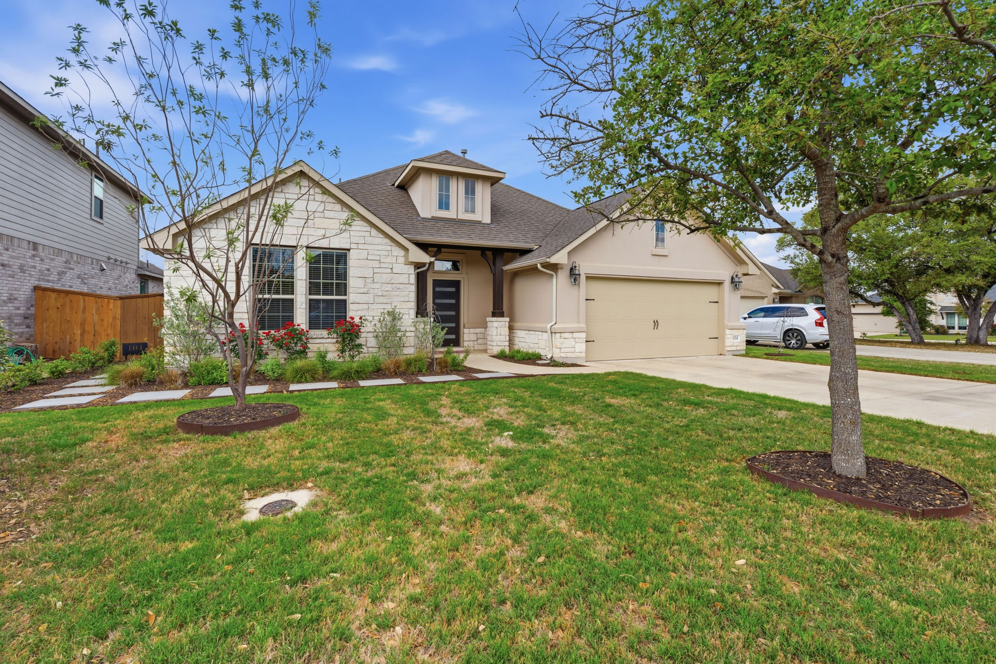 104 Red Granite Road Georgetown, TX 78633 - Photo 5 of 36 a front view of a house with garden