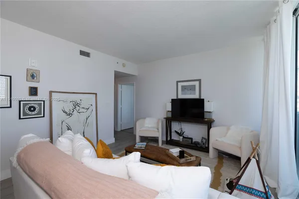 a bedroom with a bed and a chair