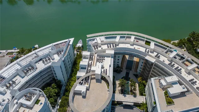 a living room with furniture a window and a flat screen tv
