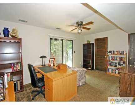 160 Stratton Street South Piscataway, NJ 08854 - Photo 5 of 8 a dining room with furniture and a chandelier