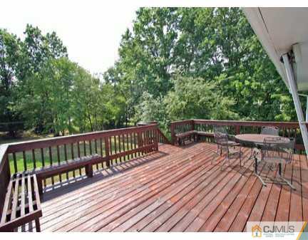 160 Stratton Street South Piscataway, NJ 08854 - Photo 8 of 8 a view of balcony with wooden floor and seating