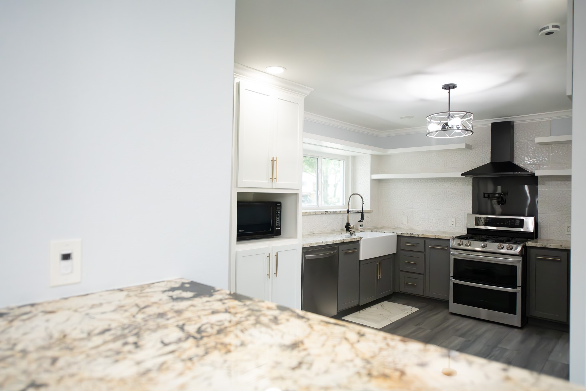 17106 Spring Creek Forest Drive Spring, TX 77379 - Photo 14 of 50 a kitchen with stainless steel appliances a stove top oven and a sink