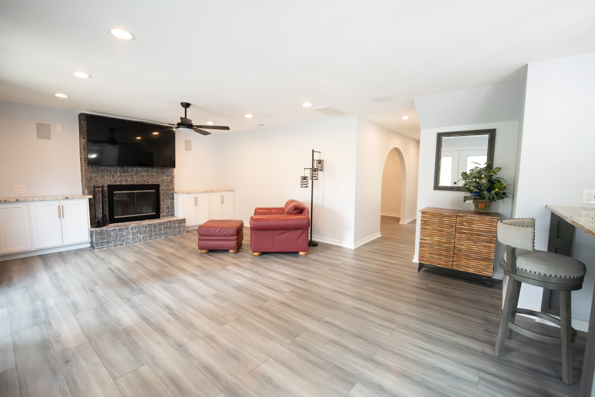 17106 Spring Creek Forest Drive Spring, TX 77379 - Photo 19 of 50 a living room with furniture flat screen tv and a fireplace