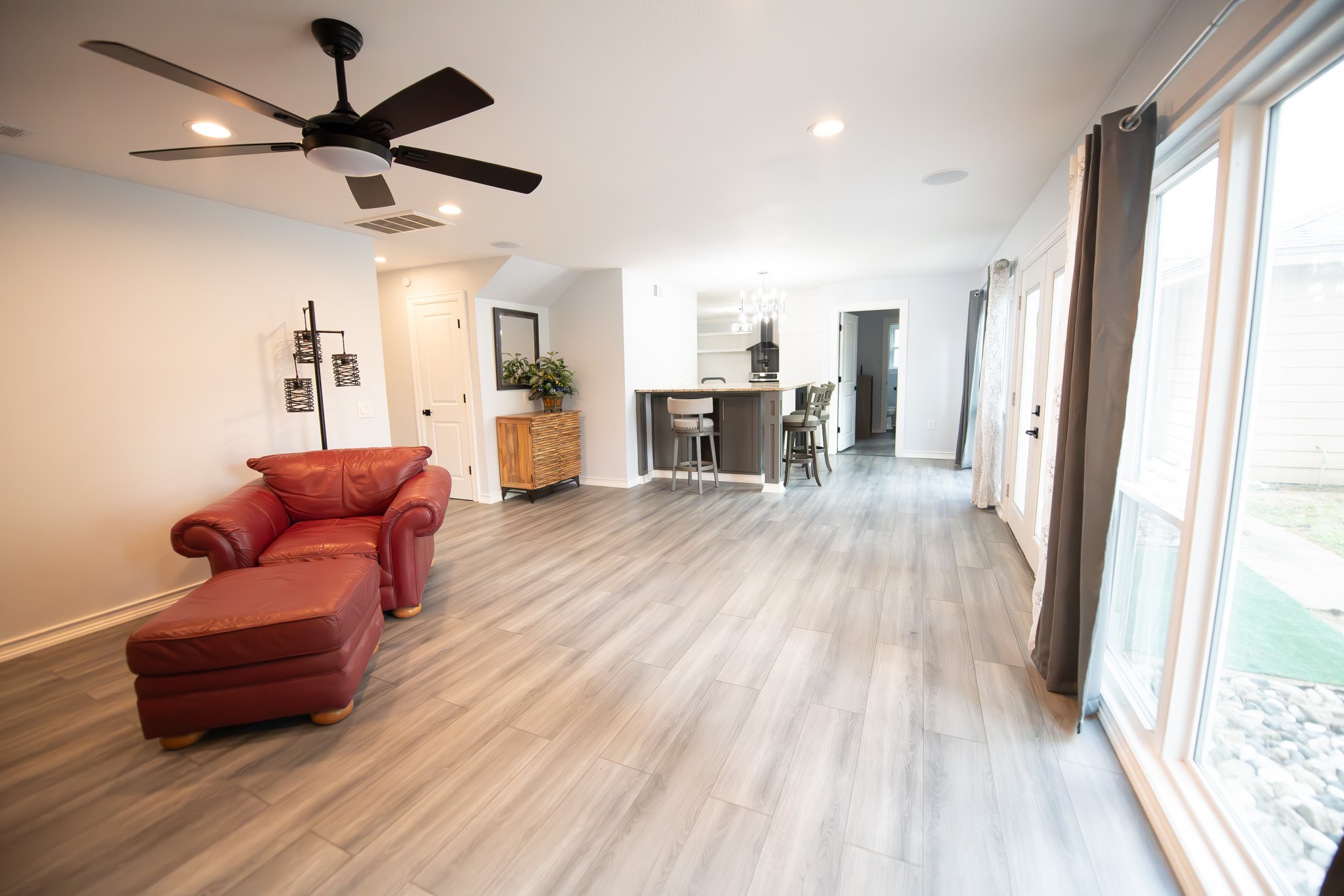17106 Spring Creek Forest Drive Spring, TX 77379 - Photo 20 of 50 a living room with furniture and wooden floor