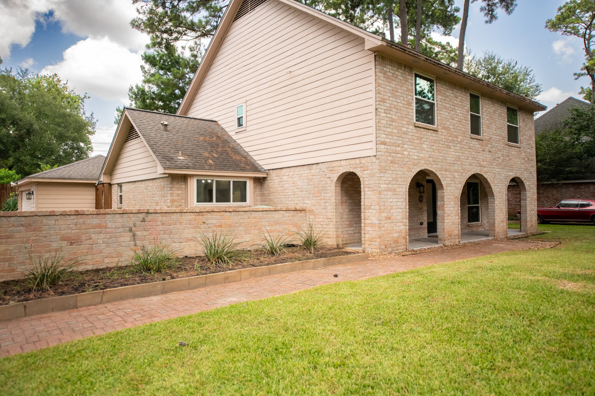 17106 Spring Creek Forest Drive Spring, TX 77379 - Photo 2 of 50 a view of a white house with a yard
