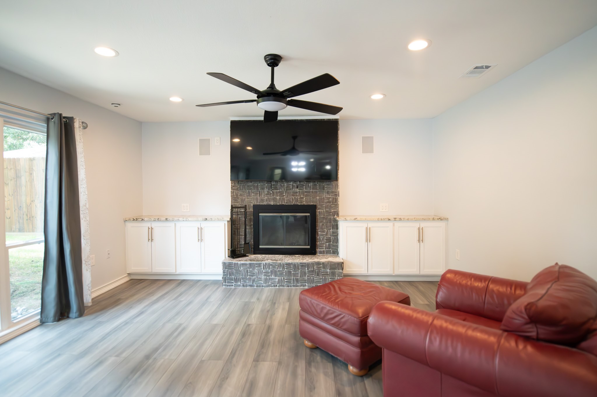 17106 Spring Creek Forest Drive Spring, TX 77379 - Photo 22 of 50 a living room with furniture and a fireplace