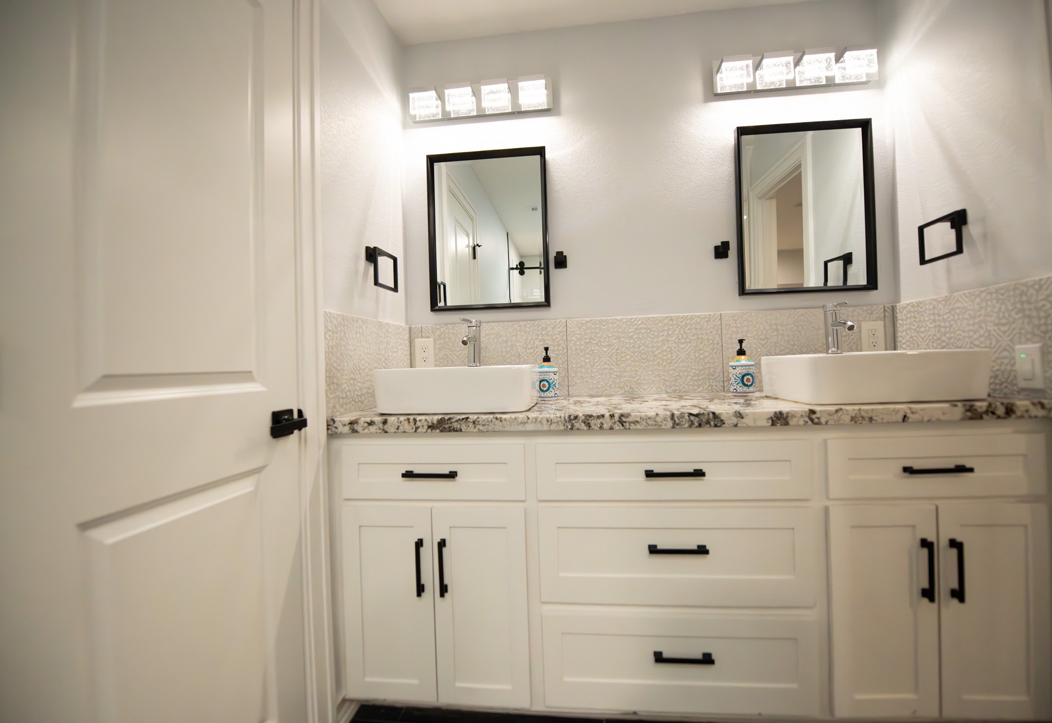 17106 Spring Creek Forest Drive Spring, TX 77379 - Photo 30 of 50 a bathroom with a sink vanity and mirror