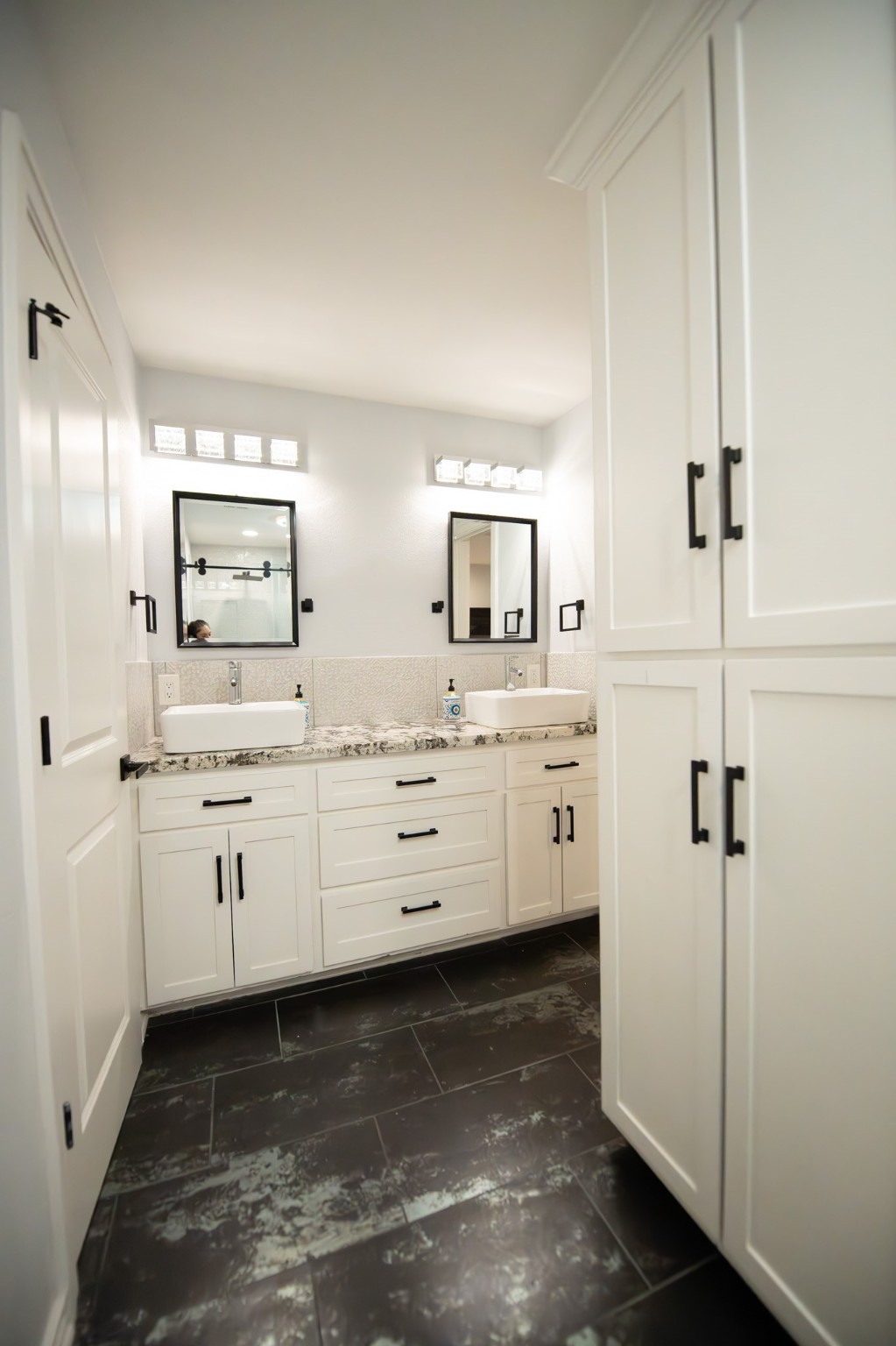 17106 Spring Creek Forest Drive Spring, TX 77379 - Photo 32 of 50 a kitchen with white cabinets and sink