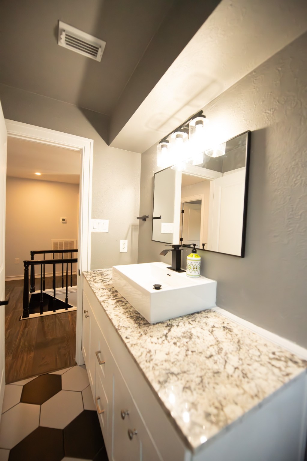 17106 Spring Creek Forest Drive Spring, TX 77379 - Photo 40 of 50 a bathroom with a granite countertop sink and a mirror