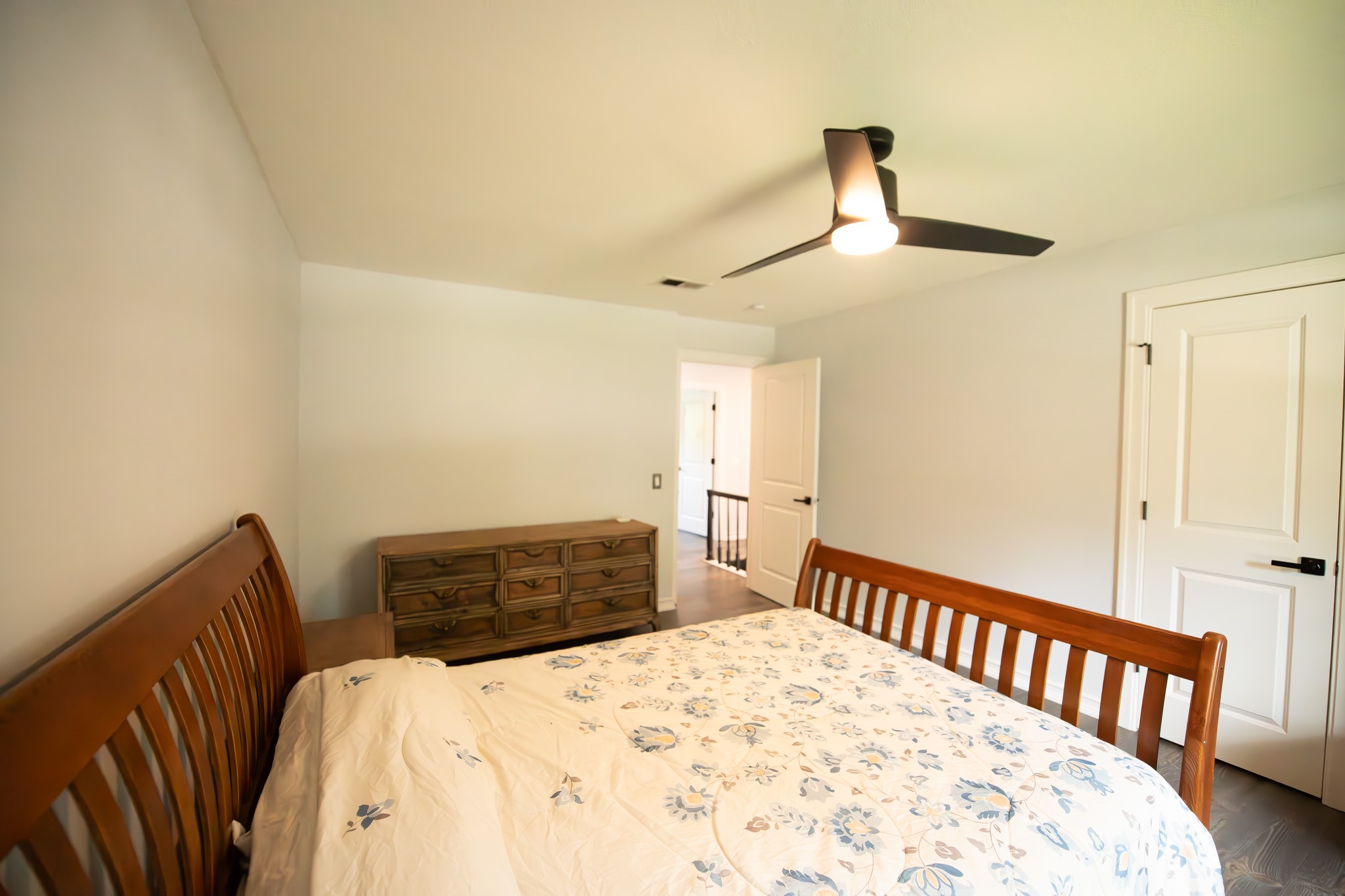 17106 Spring Creek Forest Drive Spring, TX 77379 - Photo 42 of 50 a bedroom with a bed and a chandelier