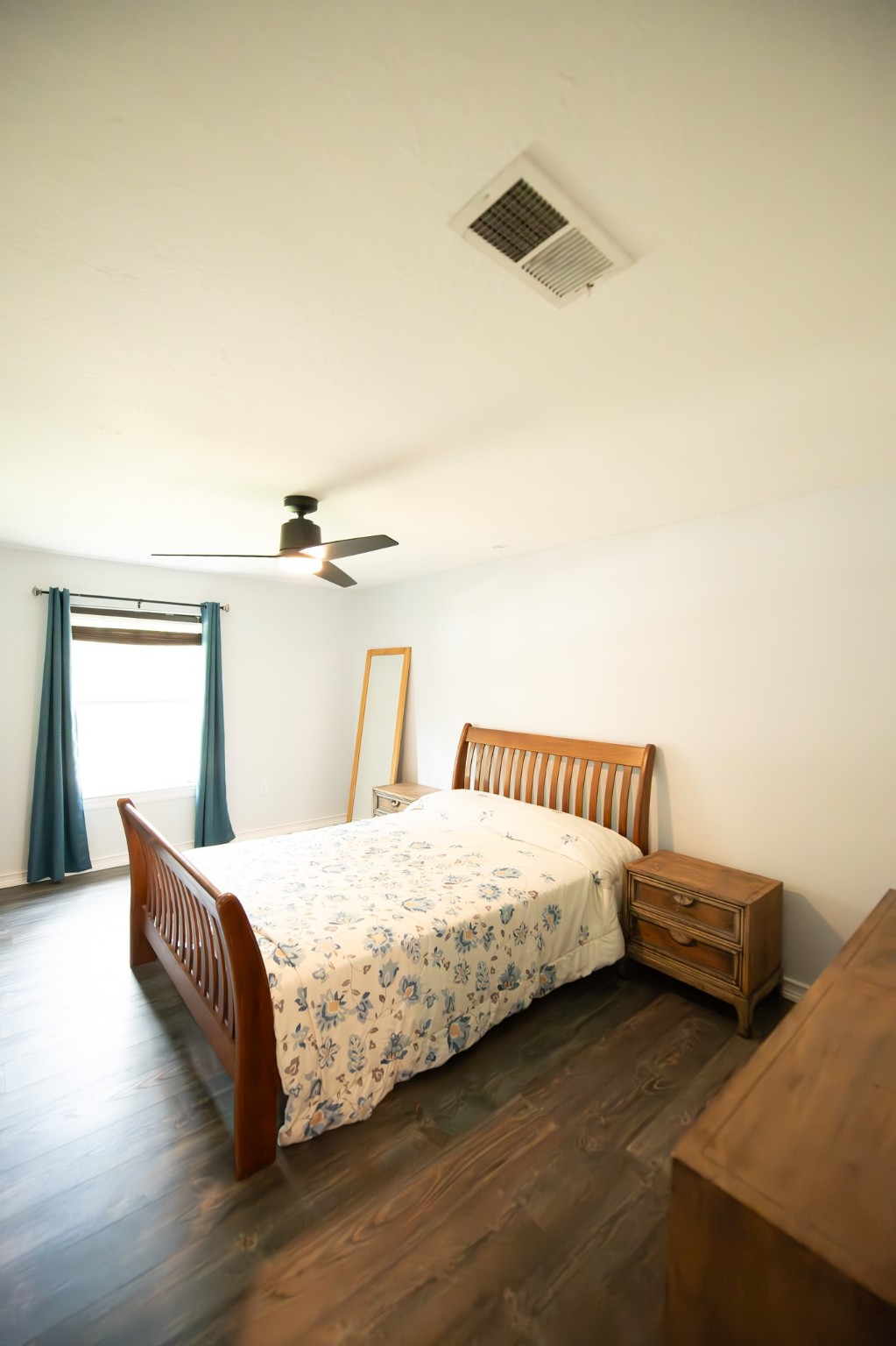 17106 Spring Creek Forest Drive Spring, TX 77379 - Photo 43 of 50 a bedroom with a bed and a night stand