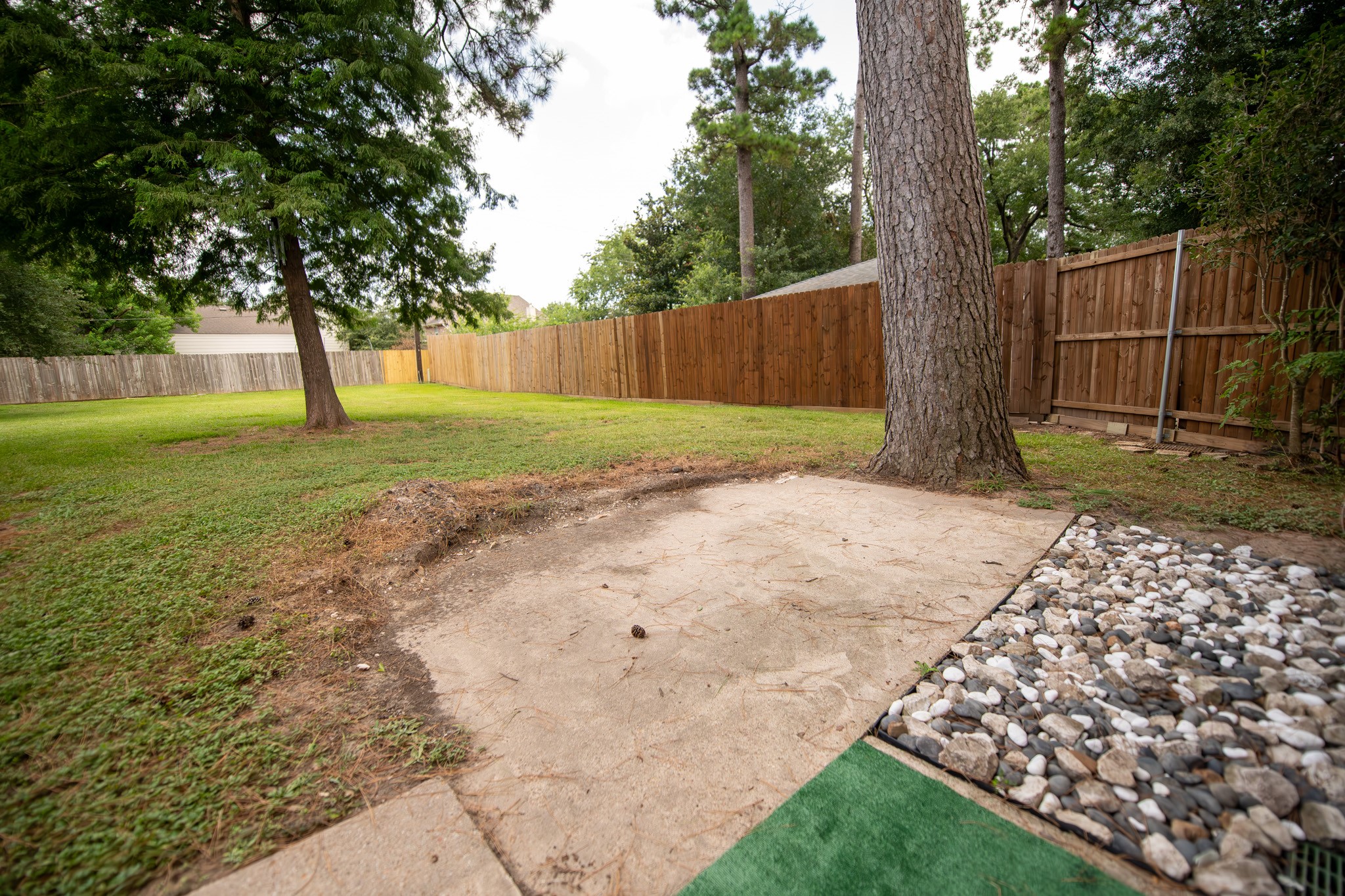 17106 Spring Creek Forest Drive Spring, TX 77379 - Photo 45 of 50 a backyard of a house with lots of green space