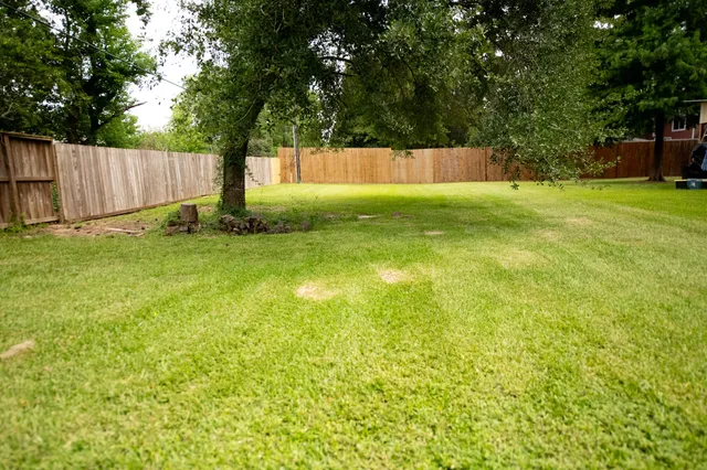 a view of swimming pool with a backyard