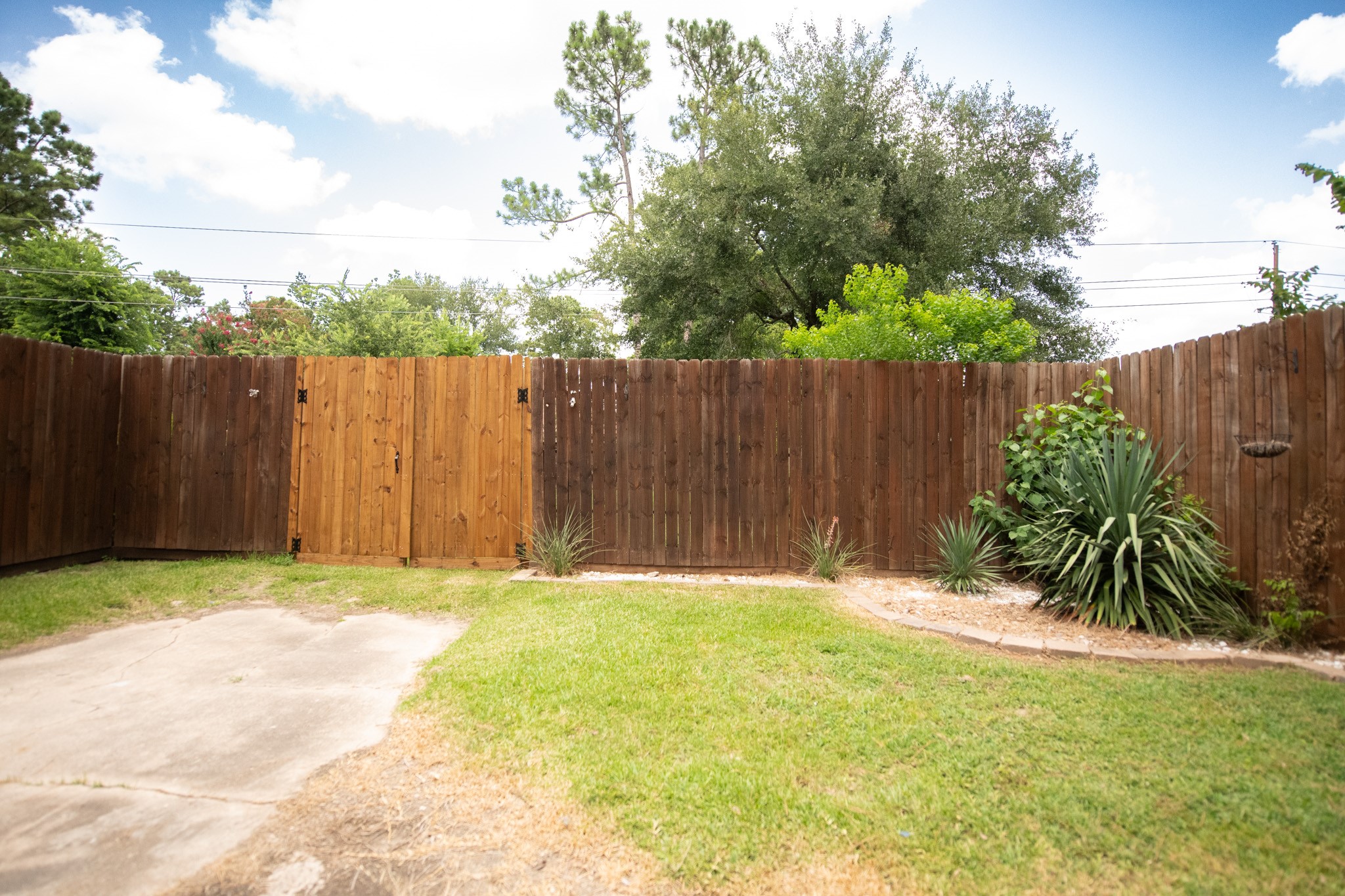 17106 Spring Creek Forest Drive Spring, TX 77379 - Photo 49 of 50 a small yard with wooden fence