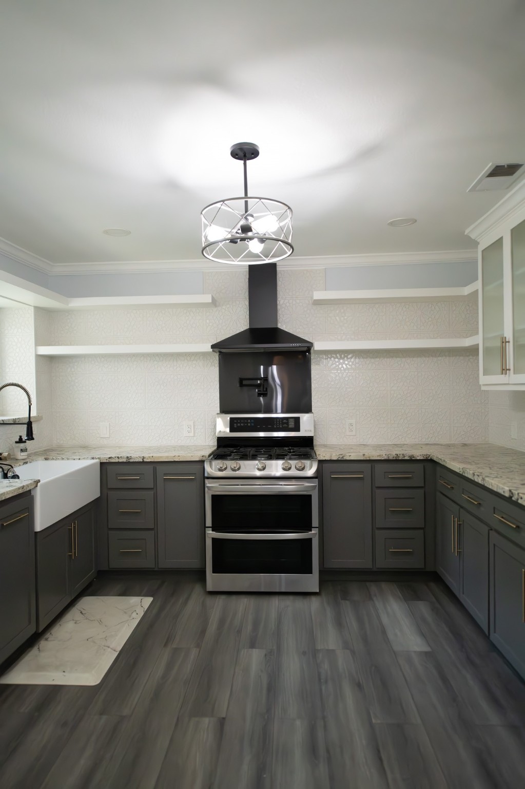 17106 Spring Creek Forest Drive Spring, TX 77379 - Photo 9 of 50 a kitchen with sink a microwave and cabinets