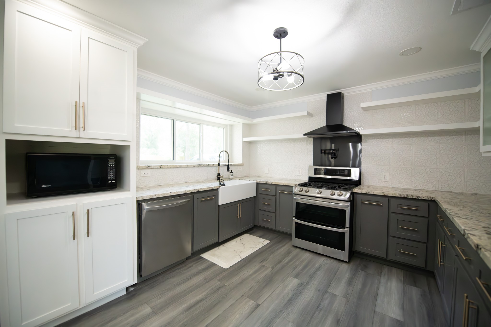 17106 Spring Creek Forest Drive Spring, TX 77379 - Photo 10 of 50 a kitchen with a sink stainless steel appliances and cabinets