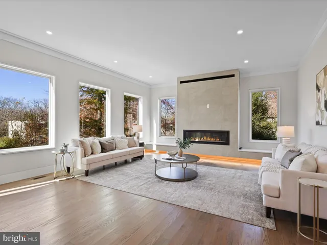 an empty room with wooden floor and a window