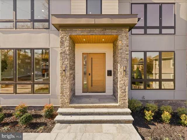 a front view of a house with a porch