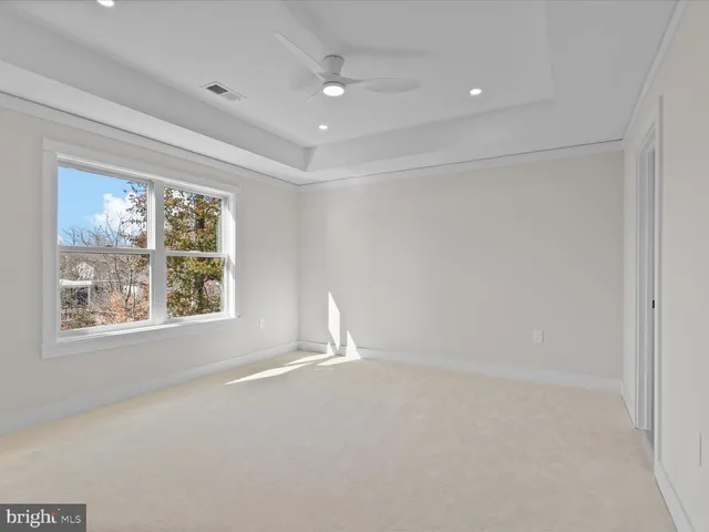 a bathroom with a sink a toilet a mirror a vanity and bathtub