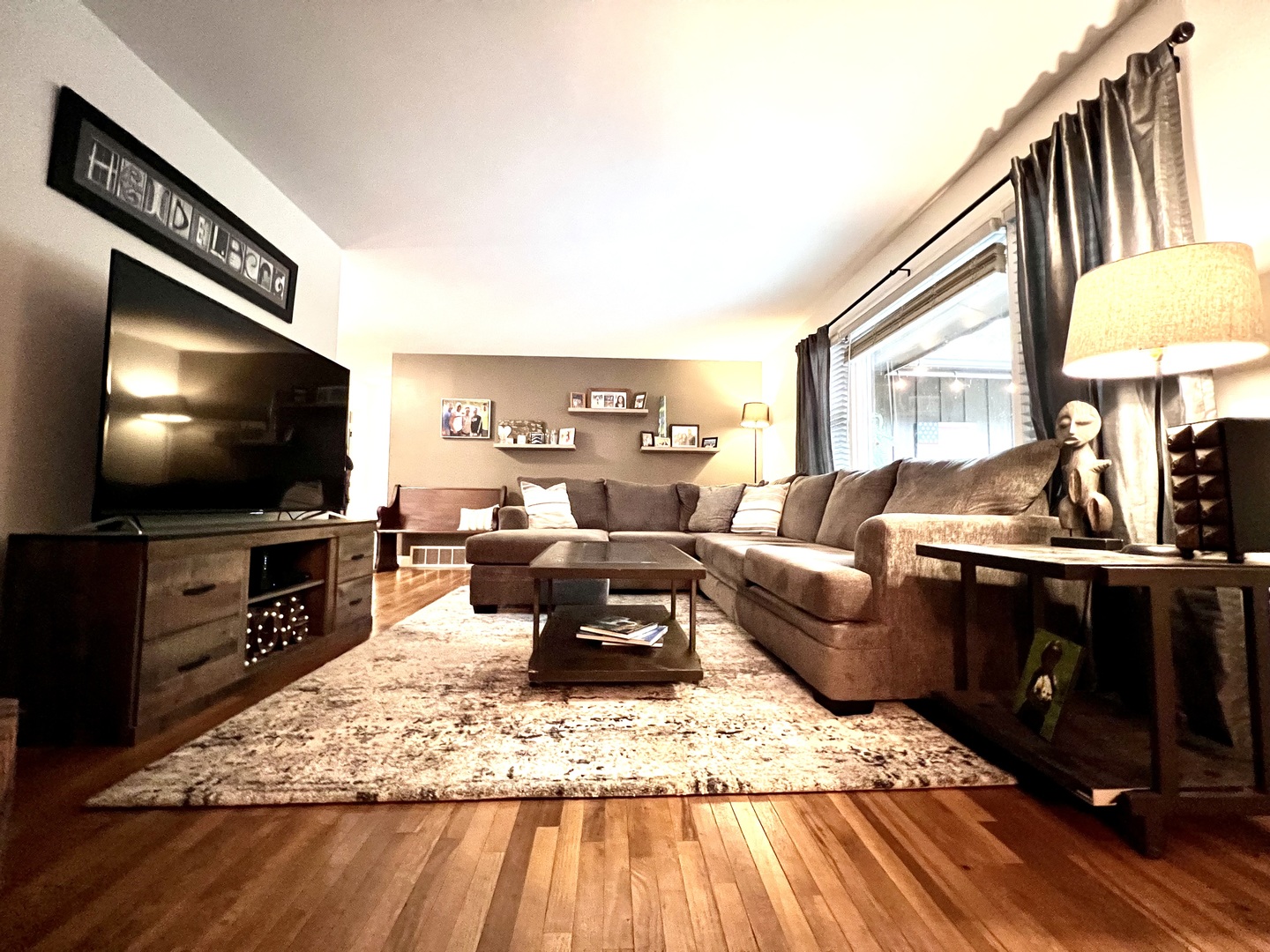9128 North 1900 East Road Bloomington, IL 61705 - Photo 11 of 36 a living room with furniture and a flat screen tv