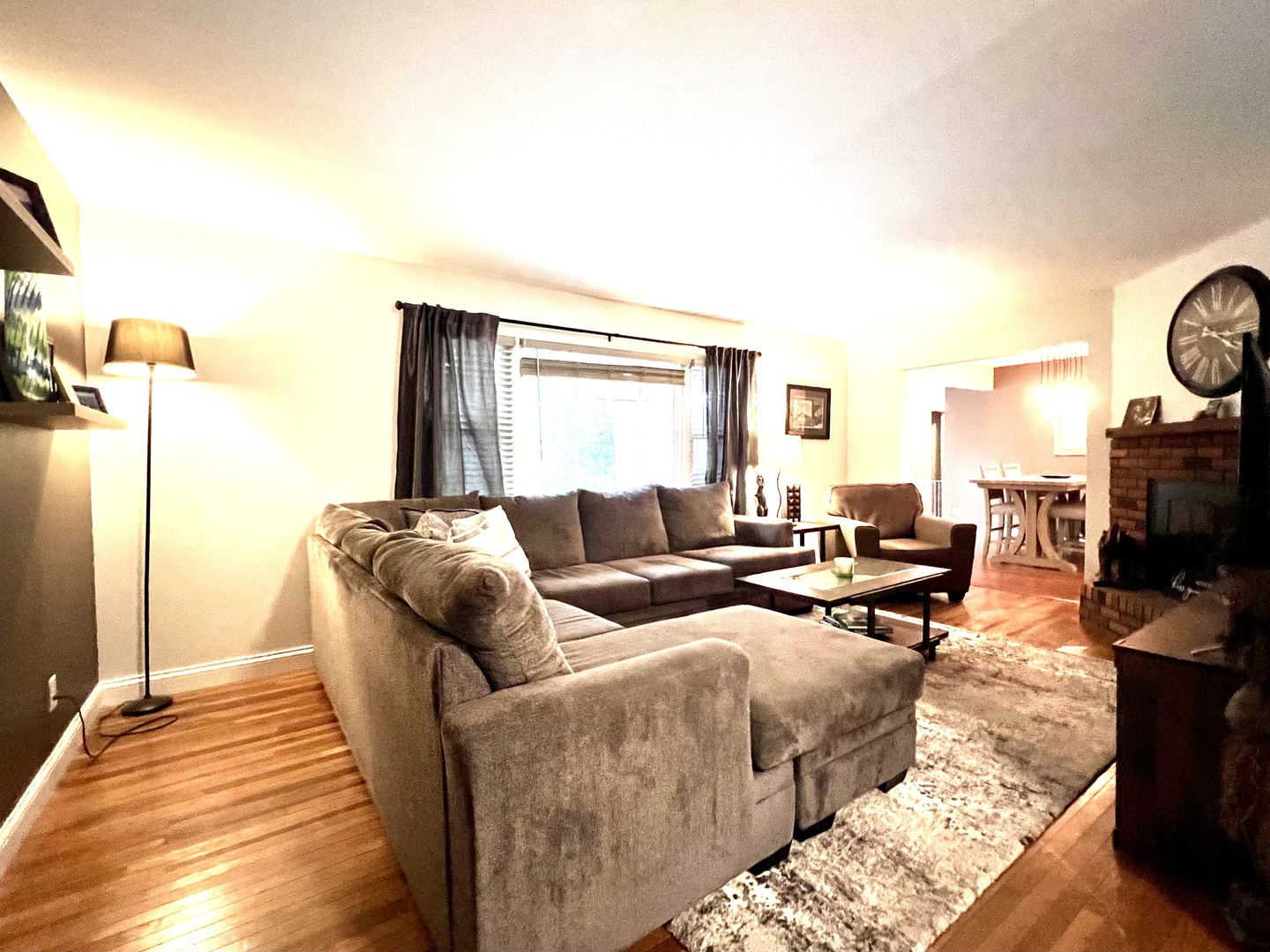 9128 North 1900 East Road Bloomington, IL 61705 - Photo 13 of 36 a living room with furniture and a fireplace