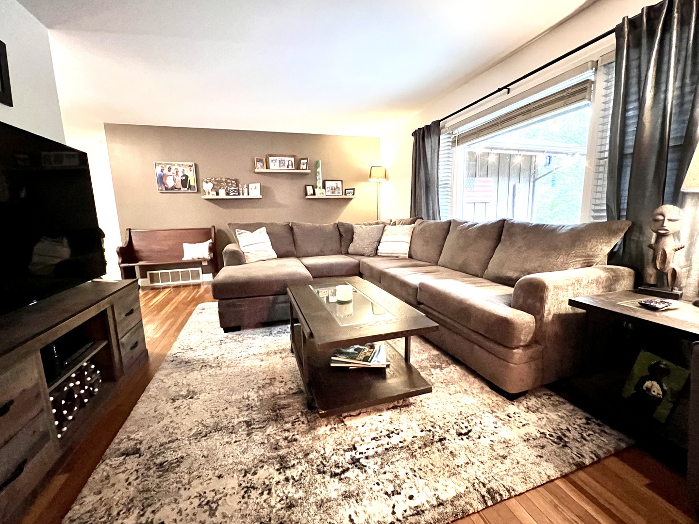 9128 North 1900 East Road Bloomington, IL 61705 - Photo 14 of 36 a living room with furniture and a flat screen tv