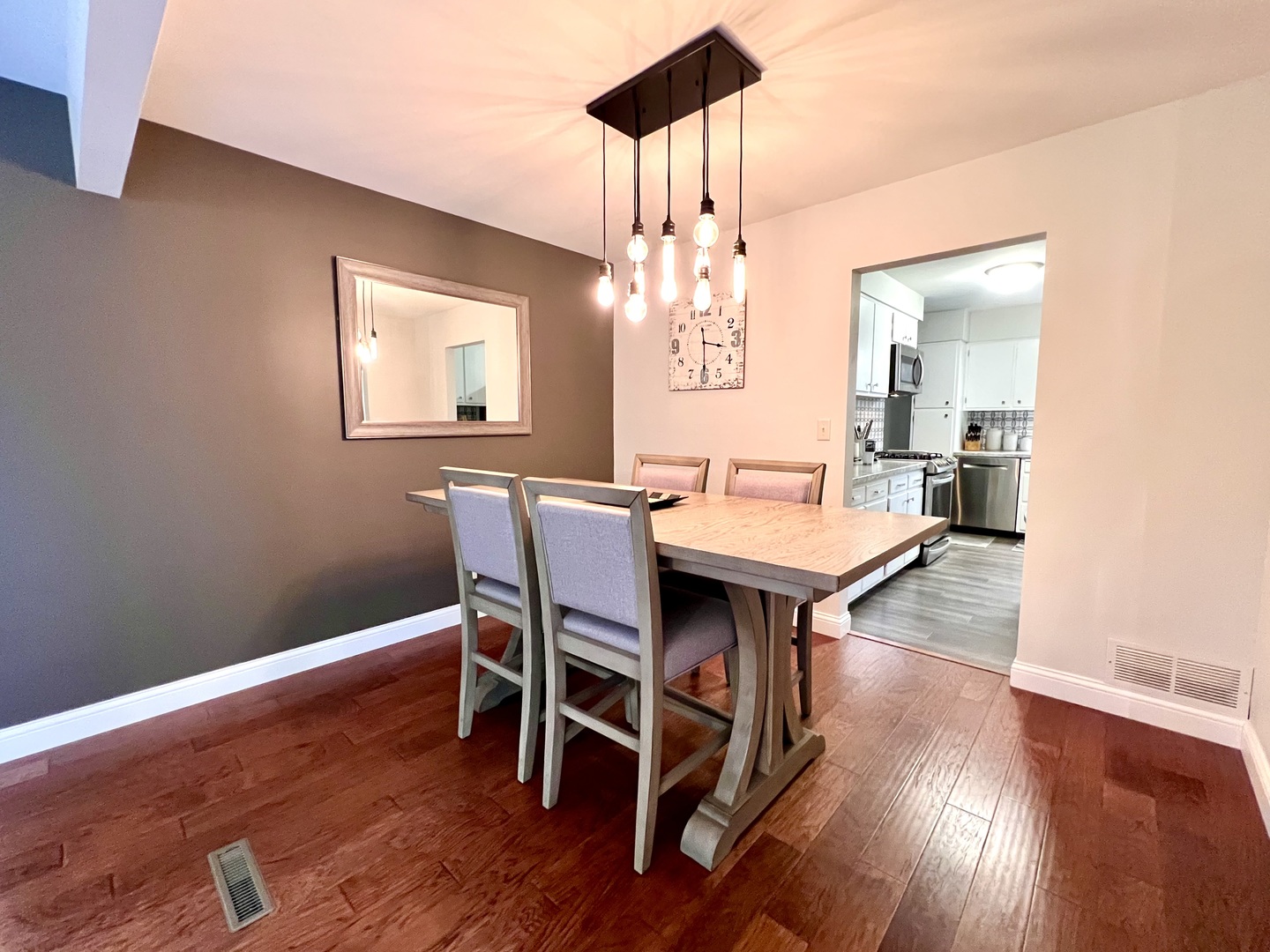 9128 North 1900 East Road Bloomington, IL 61705 - Photo 15 of 36 a view of a dining room with furniture window and wooden floor