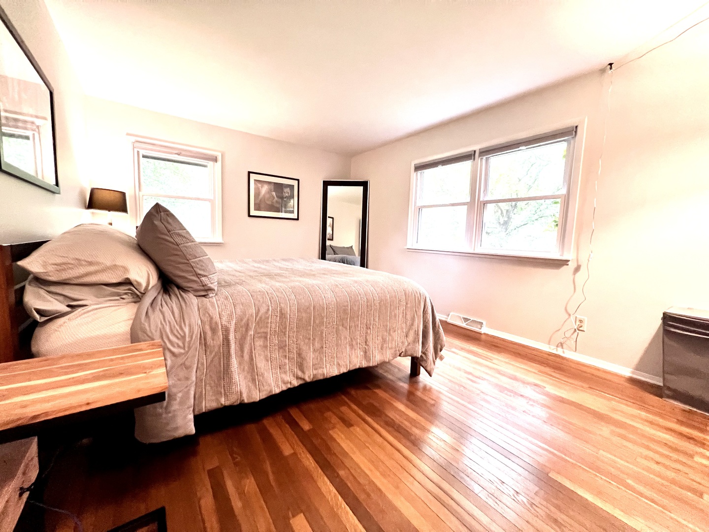 9128 North 1900 East Road Bloomington, IL 61705 - Photo 20 of 36 a bedroom with a bed and wooden floor