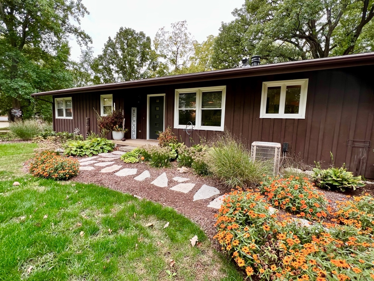 9128 North 1900 East Road Bloomington, IL 61705 - Photo 2 of 36 a front view of a house with garden