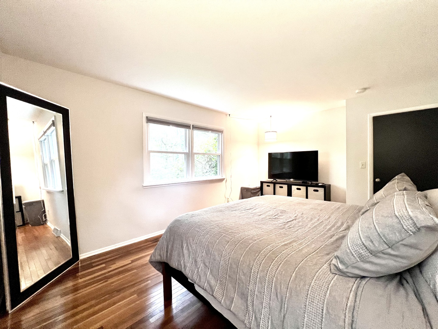 9128 North 1900 East Road Bloomington, IL 61705 - Photo 21 of 36 a bedroom with a bed and wooden floor