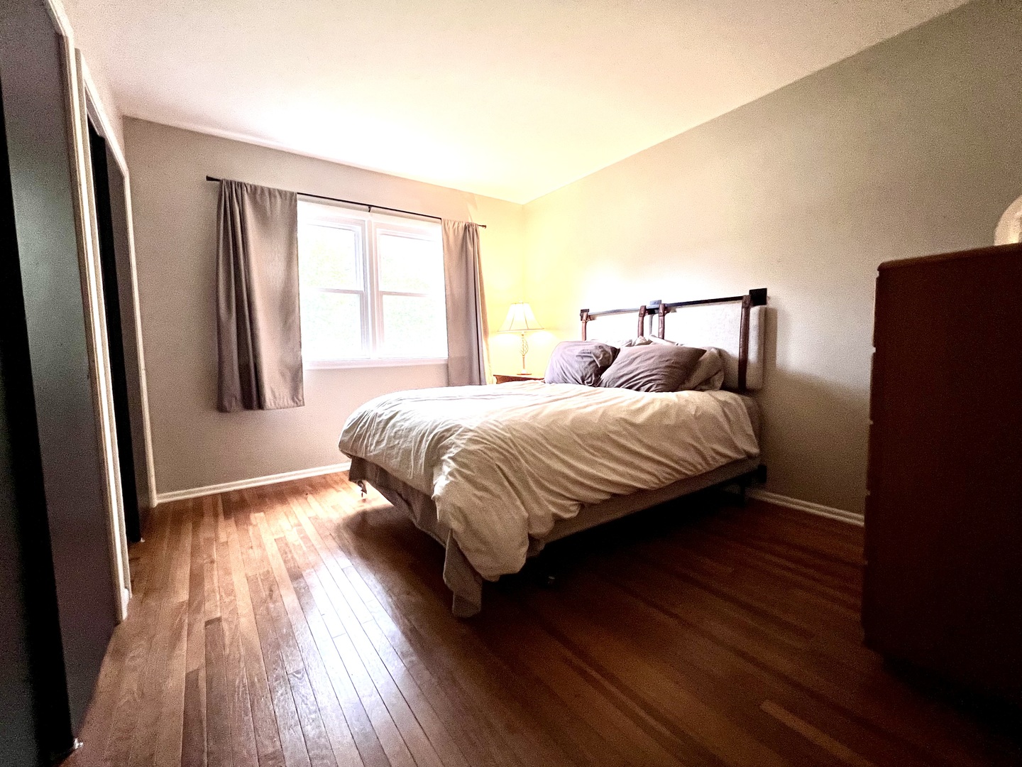 9128 North 1900 East Road Bloomington, IL 61705 - Photo 24 of 36 a bedroom with a bed and wooden floor