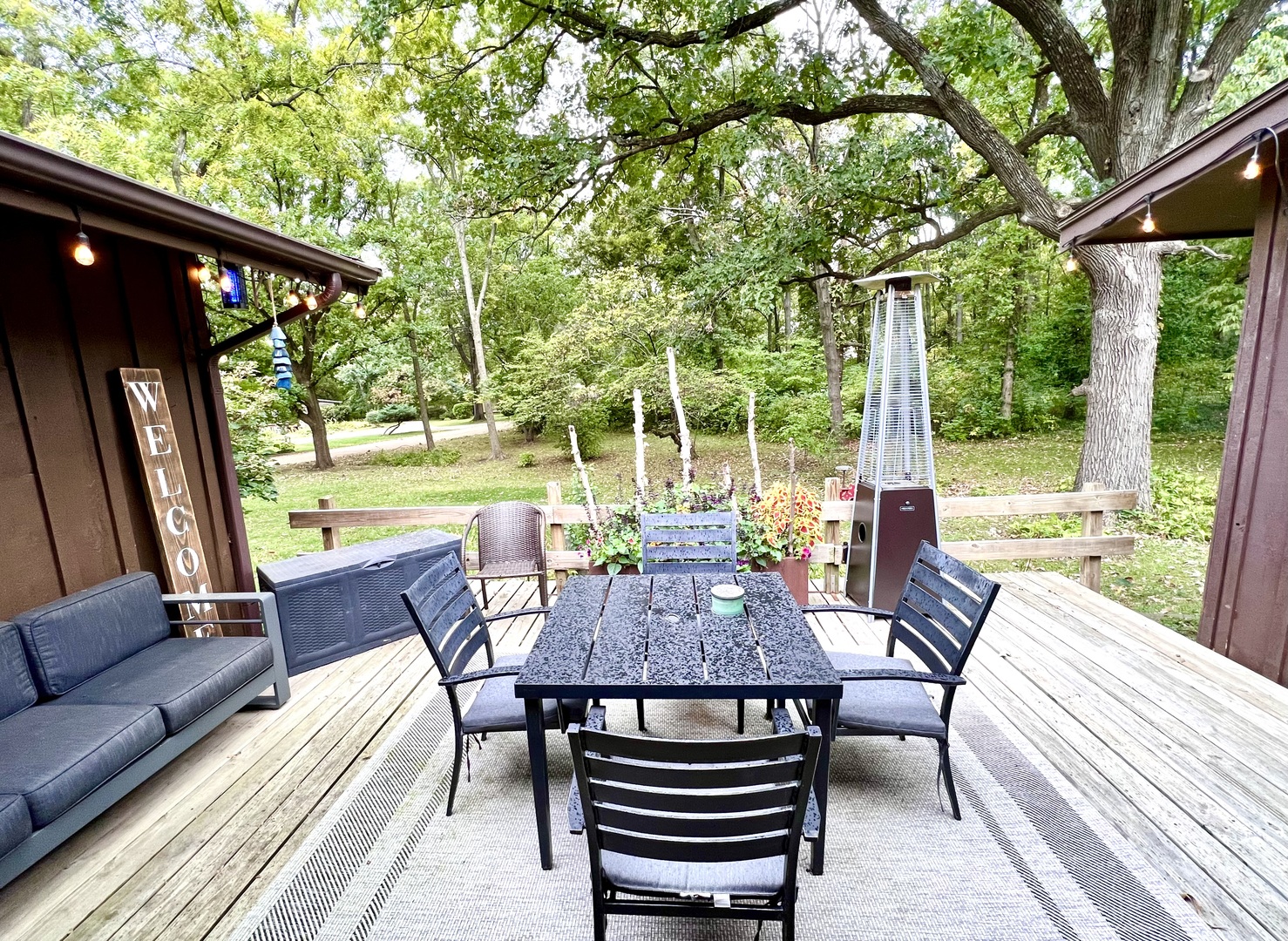 9128 North 1900 East Road Bloomington, IL 61705 - Photo 4 of 36 a view of a patio with a table chairs and a backyard