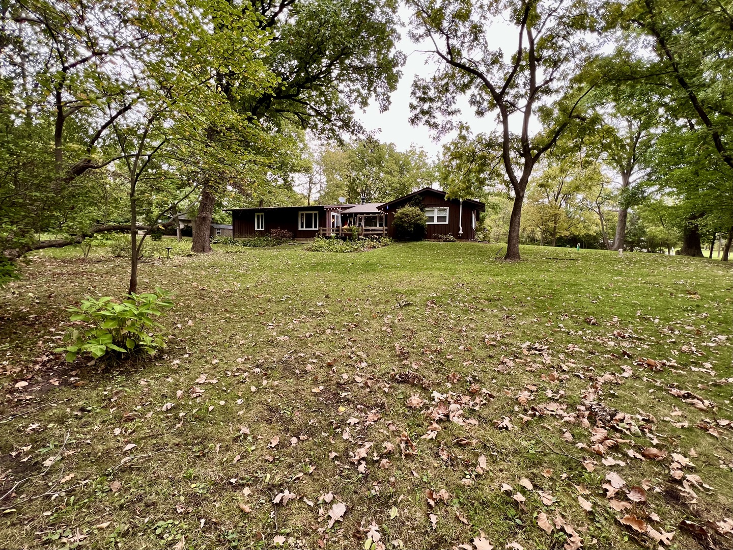 9128 North 1900 East Road Bloomington, IL 61705 - Photo 5 of 36 a front view of a house with a yard