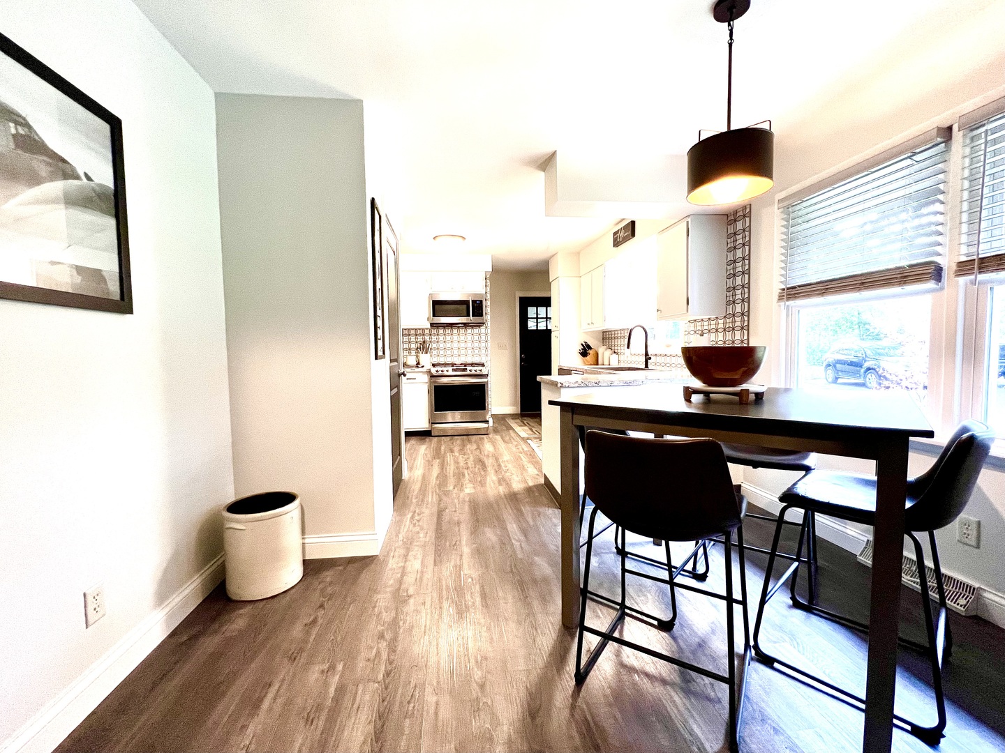 9128 North 1900 East Road Bloomington, IL 61705 - Photo 7 of 36 a living room with a table and chairs