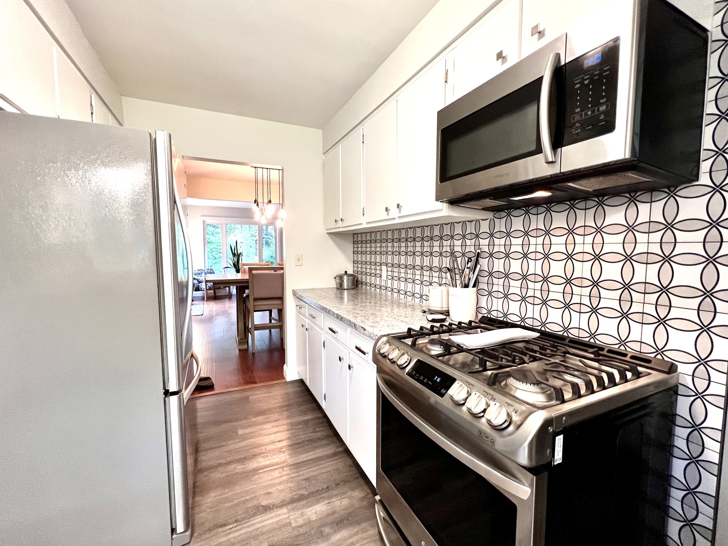 9128 North 1900 East Road Bloomington, IL 61705 - Photo 8 of 36 a kitchen with a stove and a microwave
