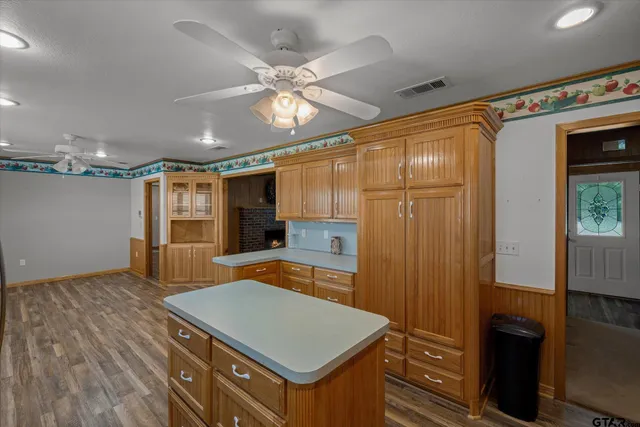 a room with pool table and windows