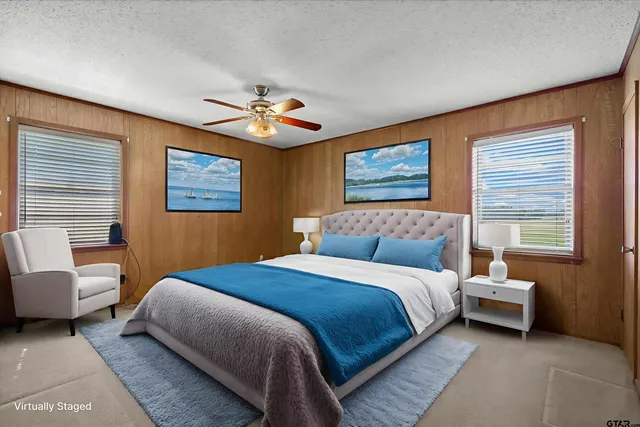 a bedroom with a bed and a couch