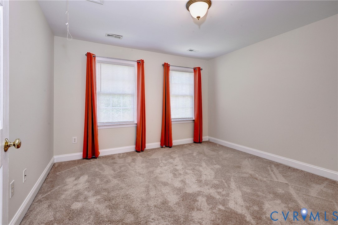 11385 Winding River Road Providence Forge, VA 23140 - Photo 34 of 43 an empty room with a empty space and windows
