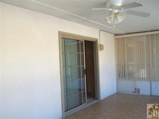 70130 Chappel Road Rancho Mirage, CA 92270 - Photo 16 of 20 an empty room with windows and fan