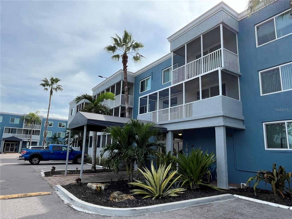 a front view of multiple houses with yard
