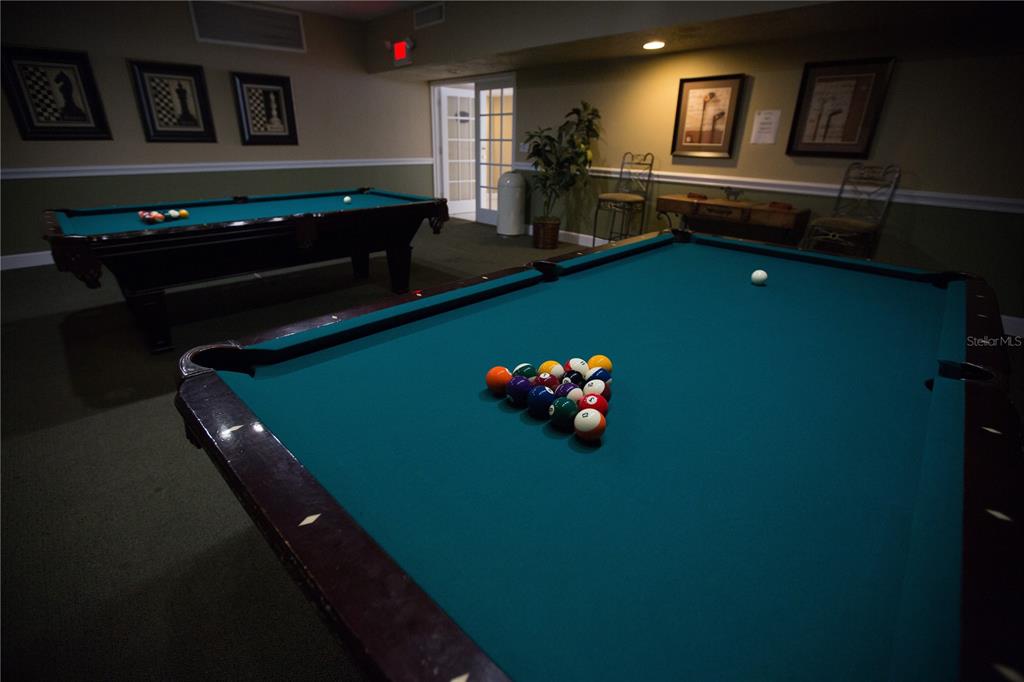 2630 Coconut Bay Lane, Unit 618 (61I) Sarasota, FL 34237 - Photo 22 of 29 a room with pool table and windows