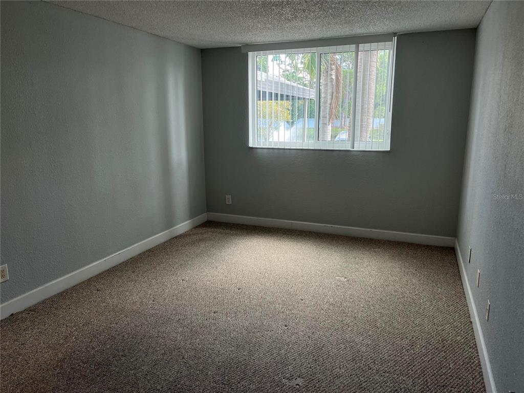 2630 Coconut Bay Lane, Unit 618 (61I) Sarasota, FL 34237 - Photo 6 of 29 an empty room with a window