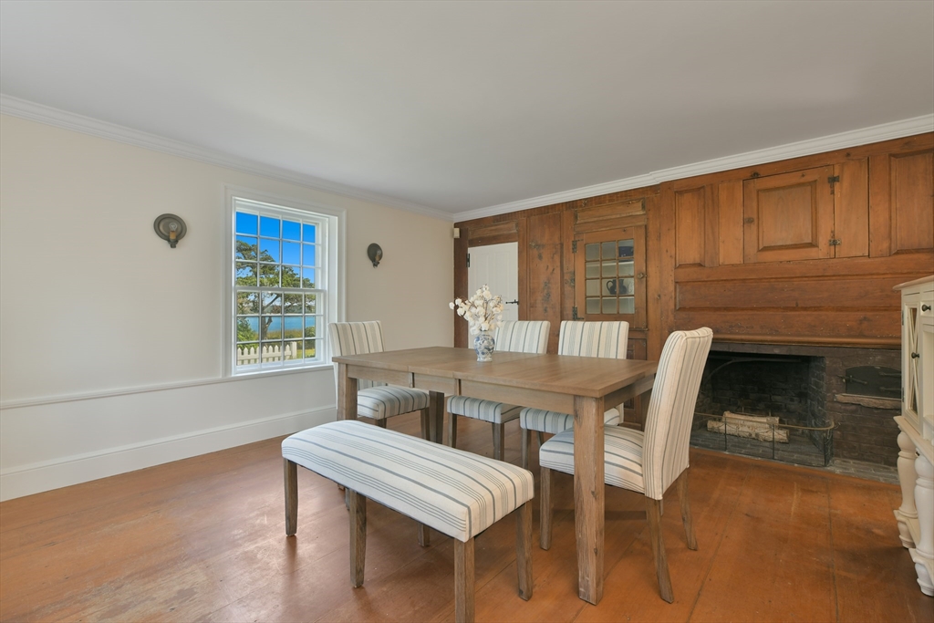 70 Sears Point Chatham, MA 02633 - Photo 15 of 42 a view of a dining room with furniture window and wooden floor