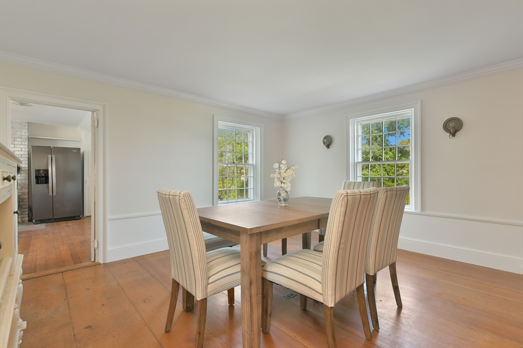70 Sears Point Chatham, MA 02633 - Photo 17 of 42 a view of a dining room with furniture and wooden floor