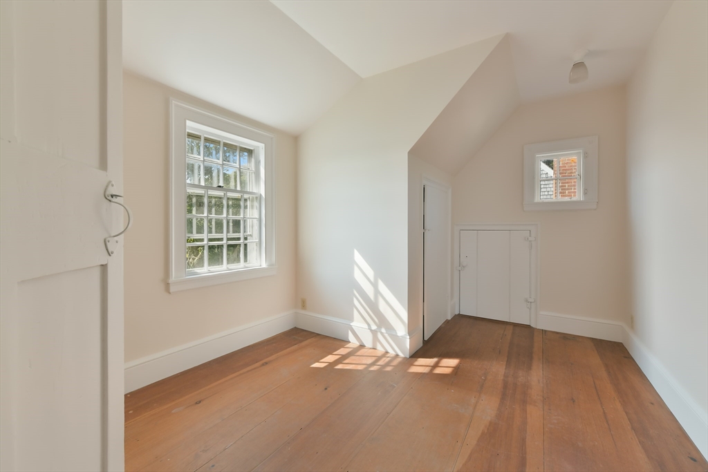 70 Sears Point Chatham, MA 02633 - Photo 26 of 42 an empty room with wooden floor and windows
