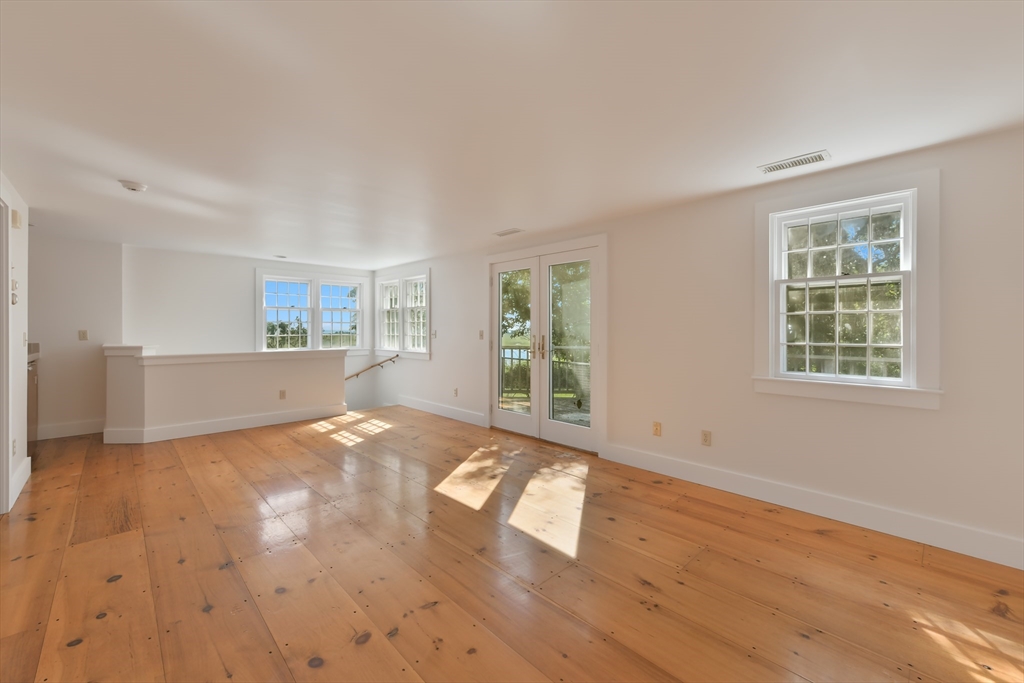70 Sears Point Chatham, MA 02633 - Photo 29 of 42 a view of an empty room with wooden floor and a window