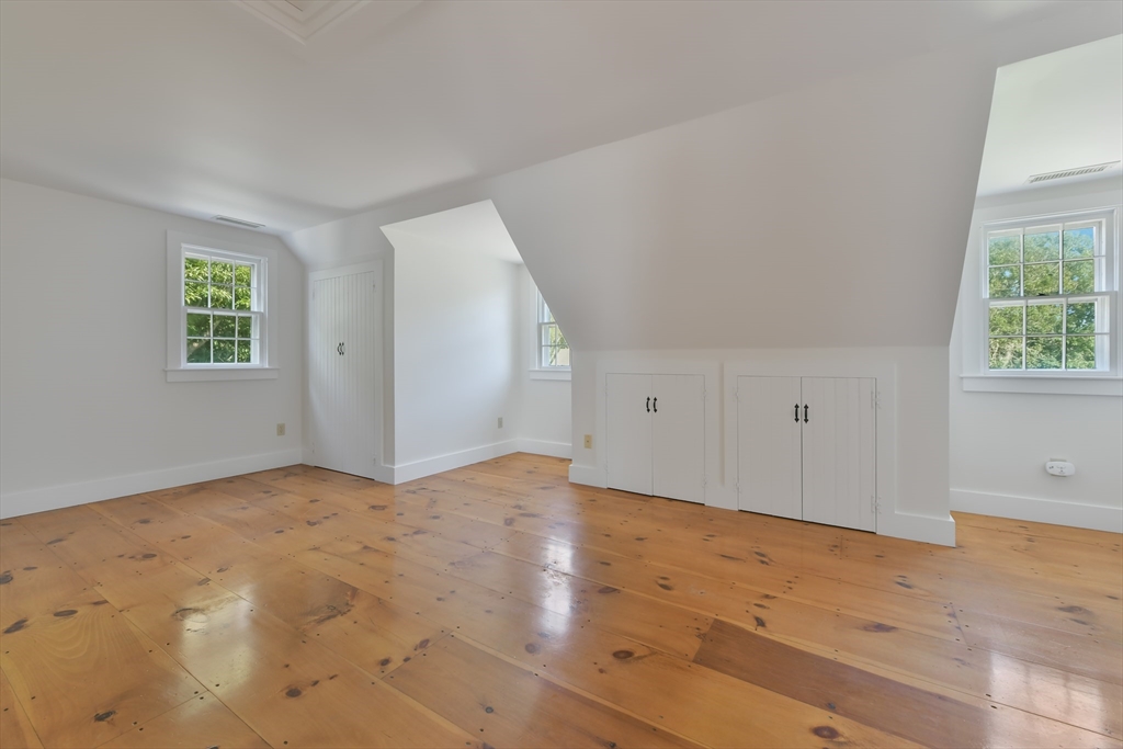 70 Sears Point Chatham, MA 02633 - Photo 30 of 42 an empty room with wooden floor and windows