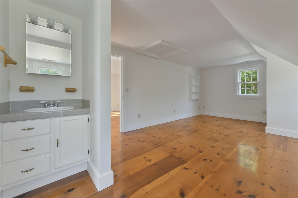 70 Sears Point Chatham, MA 02633 - Photo 31 of 42 a view of cabinet and mirror