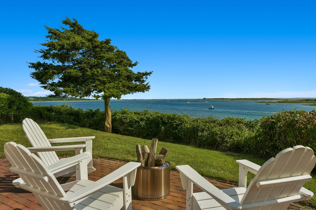 70 Sears Point Chatham, MA 02633 - Photo 33 of 42 a view of a chairs and table on the terrace